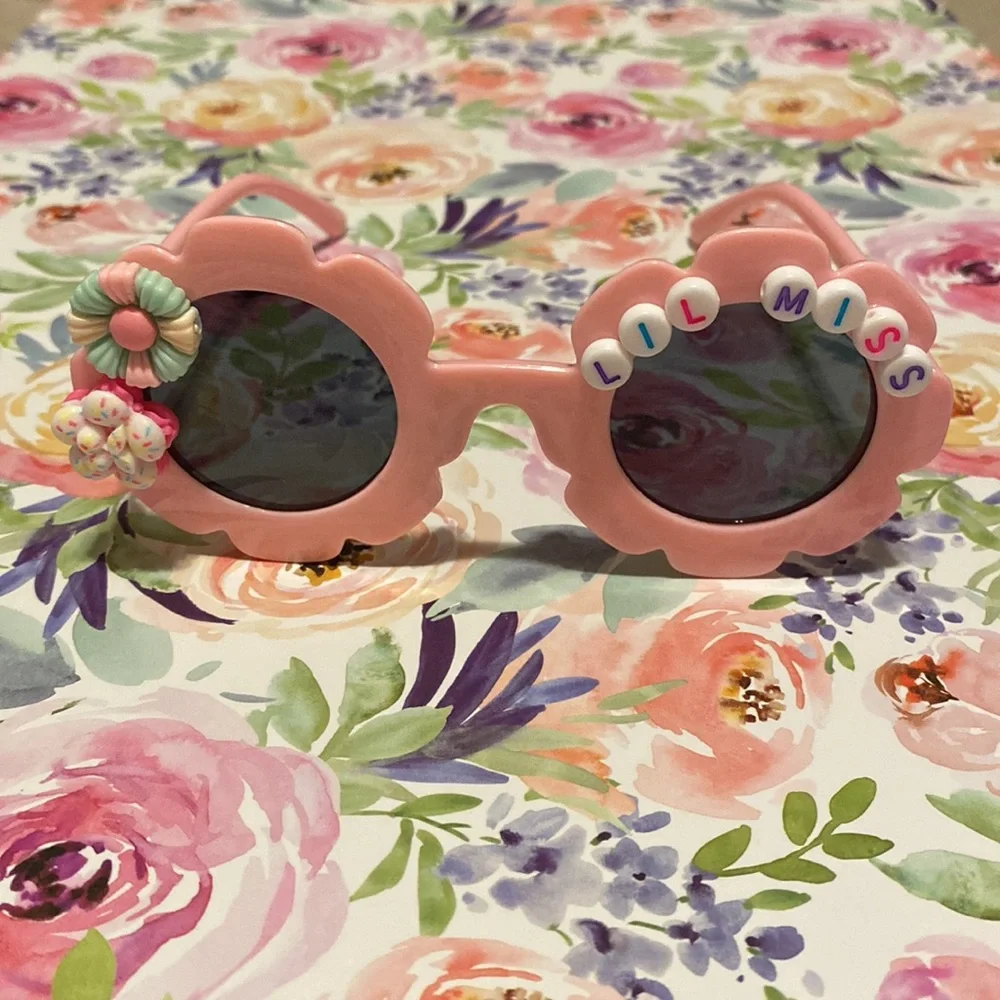Girls light pink flower shaped LiL miss sunglasses